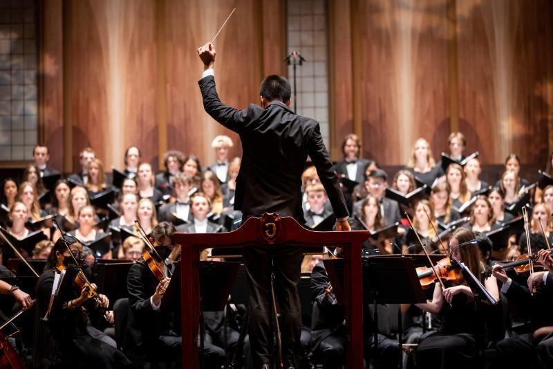Dr. Daniel Gee Conducting Choirs and Orchestra